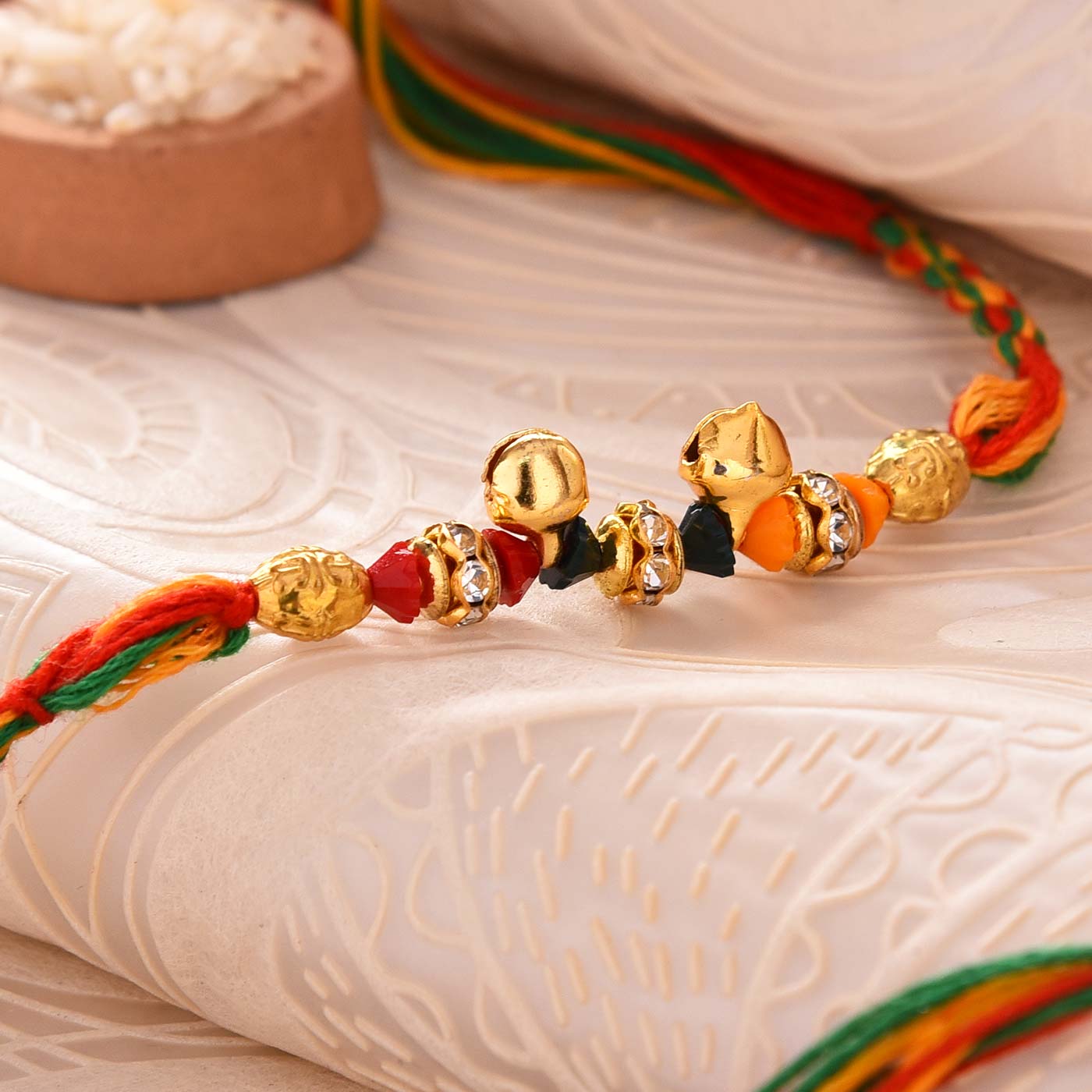 Gorgeous Ghungroo & Stones Rakhi - 12 Pcs Pack