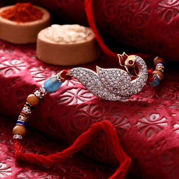 Glittering Stone Studded Peacock Rakhi - 12 Pcs Pack