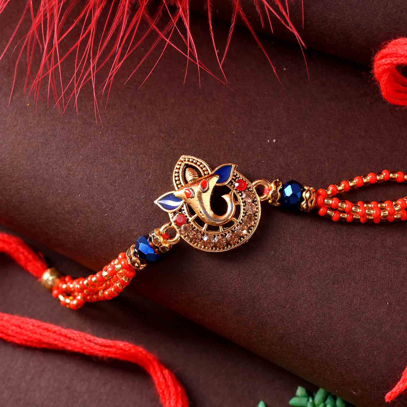 Lord Ganesha Green Beads Rakhi - 12 Pcs Pack