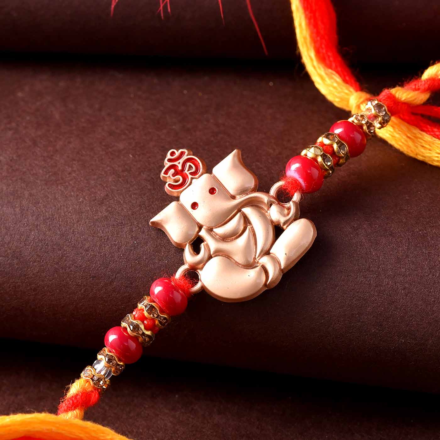 Lord Ganesha Elegant Beads Rakhi - 12 Pcs Pack