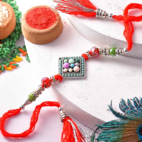 Designer Rakhi In Pastel Colours - 12 Pcs Pack