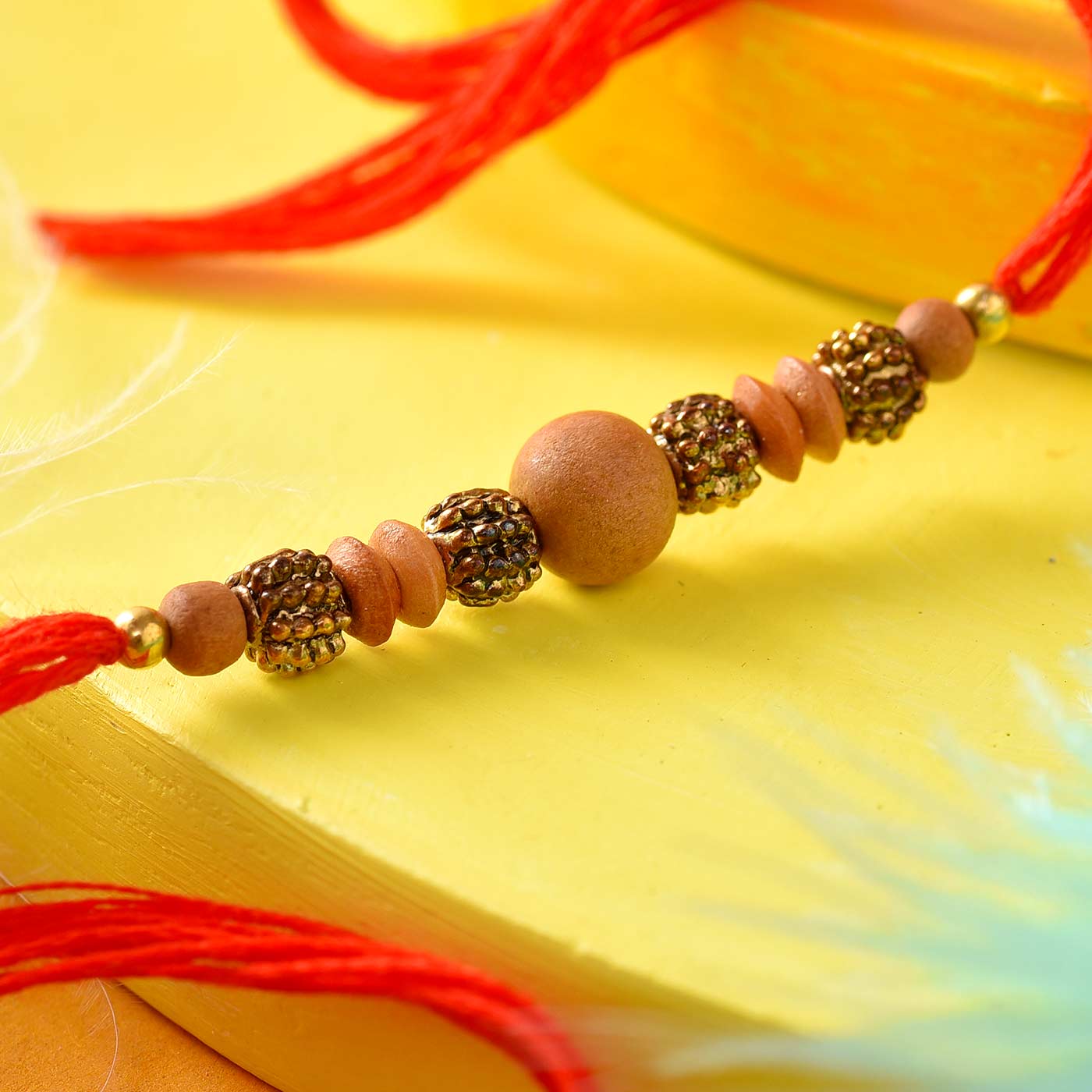 Wooden Beads Rakhi In Red Thread- 12 Pcs Pack