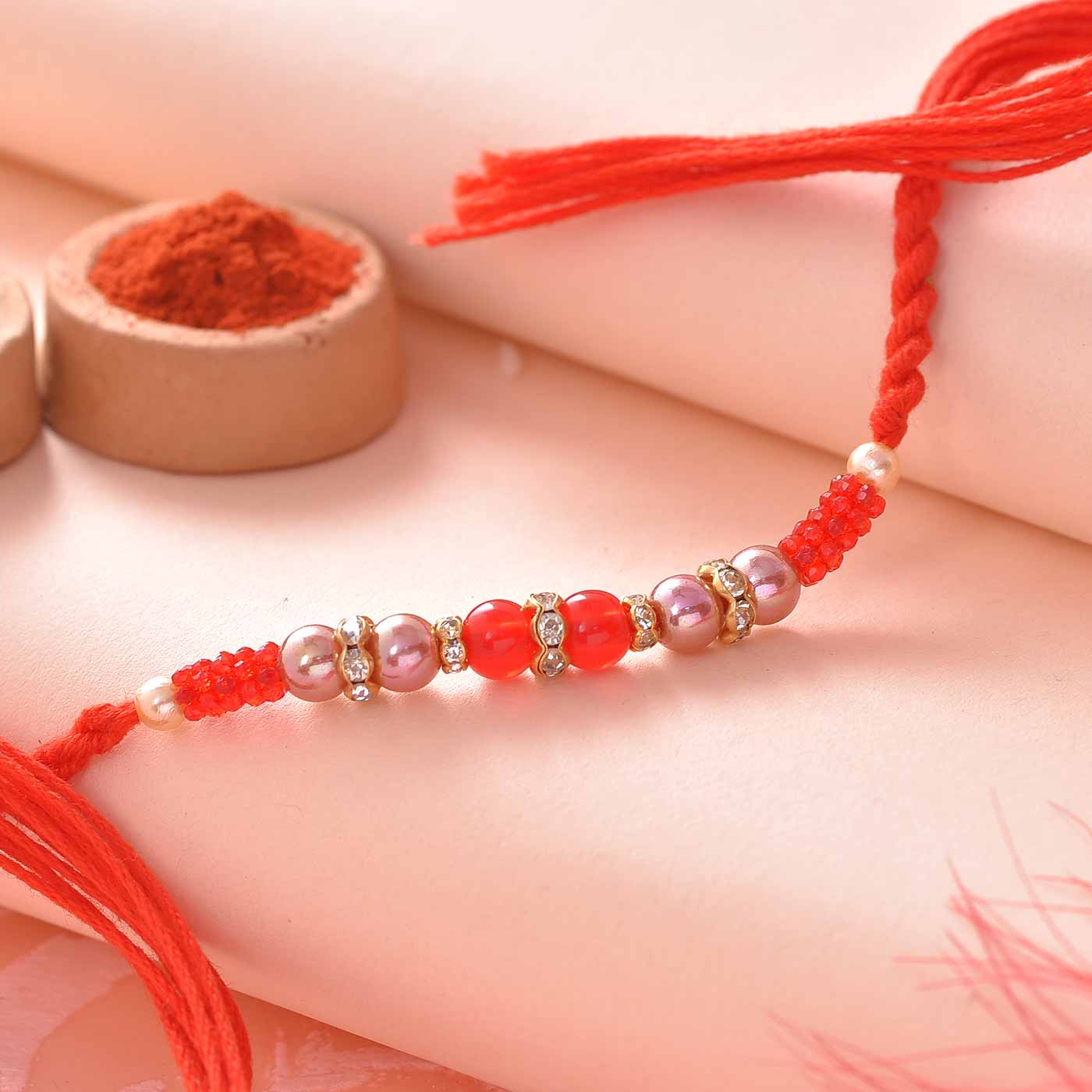 Stunning Red & Golden Beads Rakhi - 12Pcs Pack