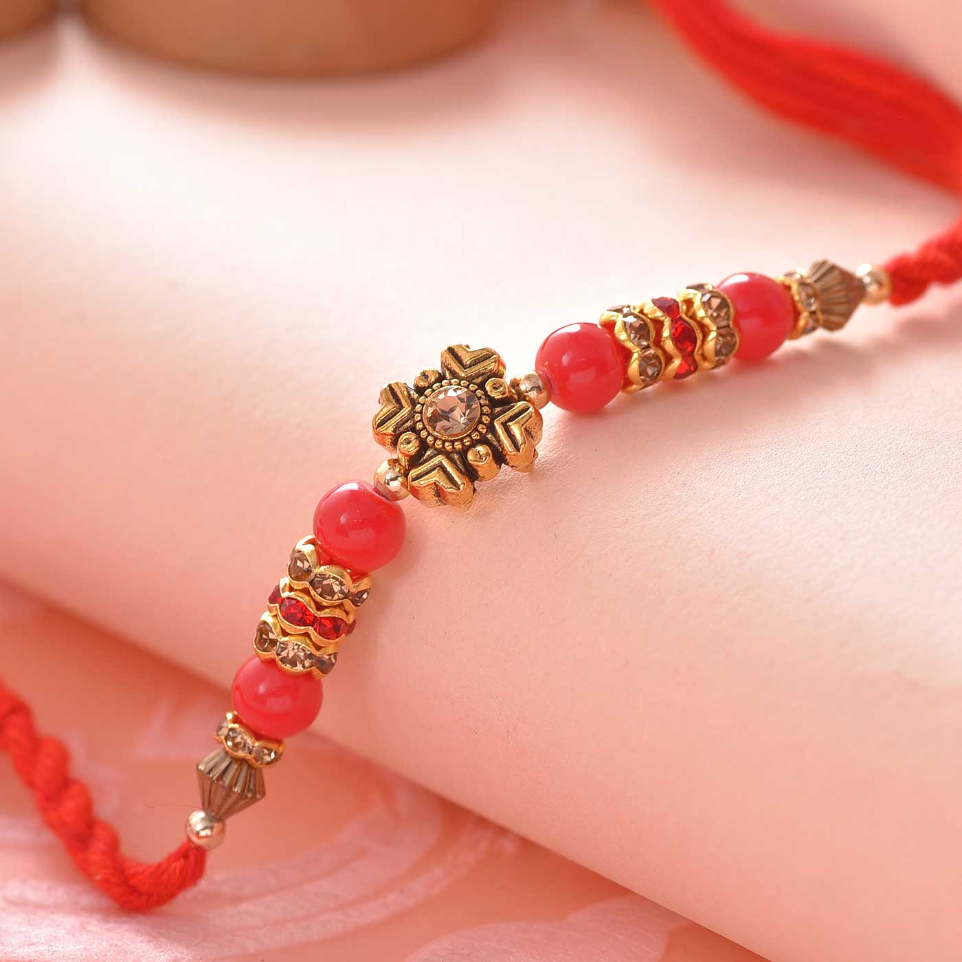 Floral Pattern & Red Beads Rakhi - 12 Pcs Pack