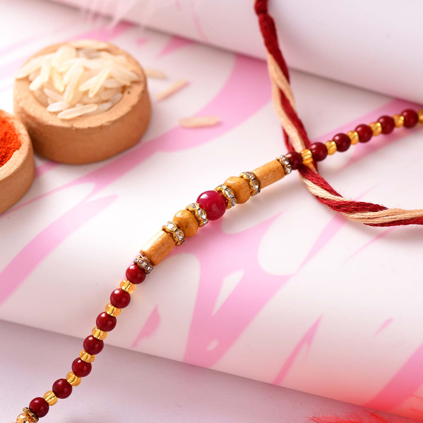 Fascinating Wooden N Dark Red Beads Rakhi-12 Pcs Pack