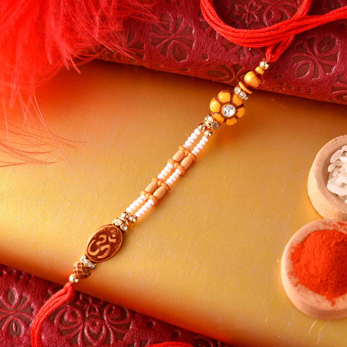 Om  Floral Pearls Divine Rakhi -12 pcs Pack