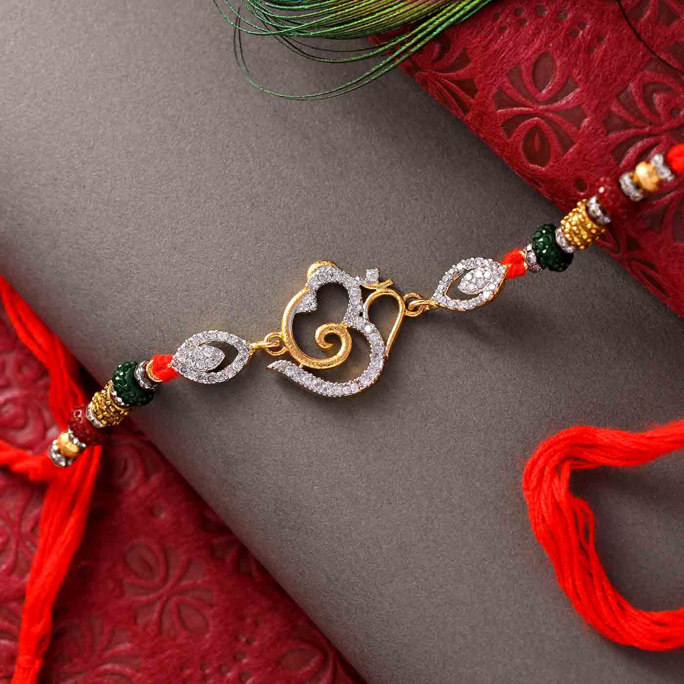 Om Ganesha Stone Work & Crystals Rakhi - 12 Pcs Pack