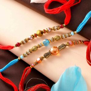 Stunning Crystals Set Of 3 Rakhis - 12 Pcs Pack