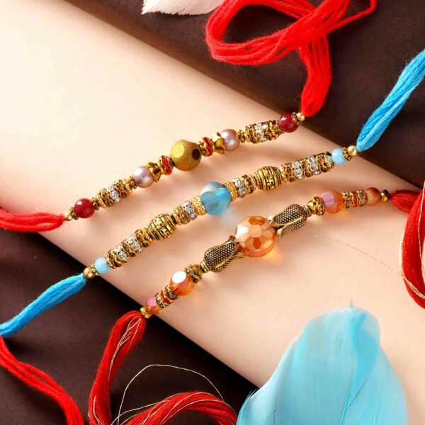 Stunning Crystals Set Of 3 Rakhis - 12 Pcs Pack