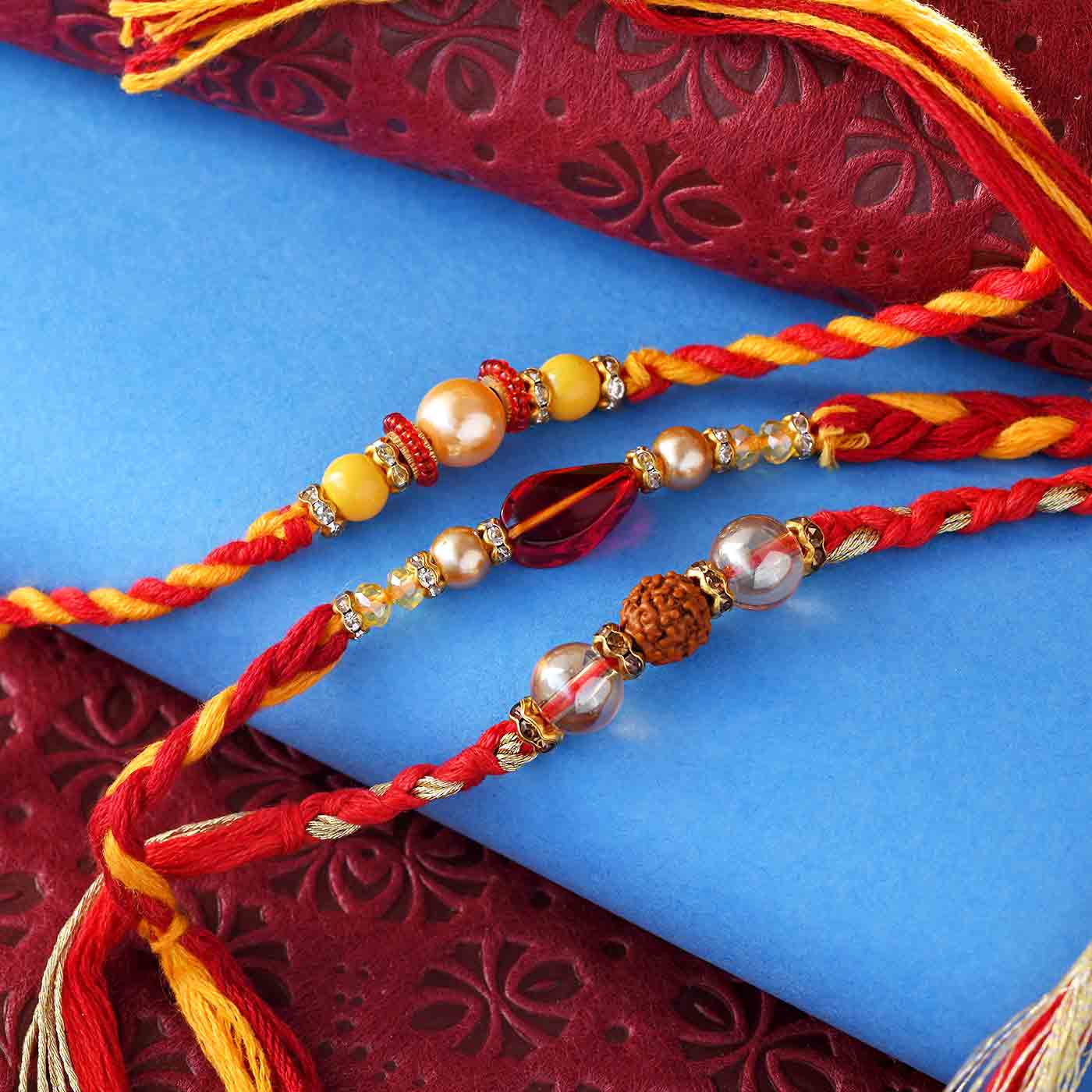 Exclusive Rudraksh & Beads Rakhi Set Of 3 - 12 Pcs Set