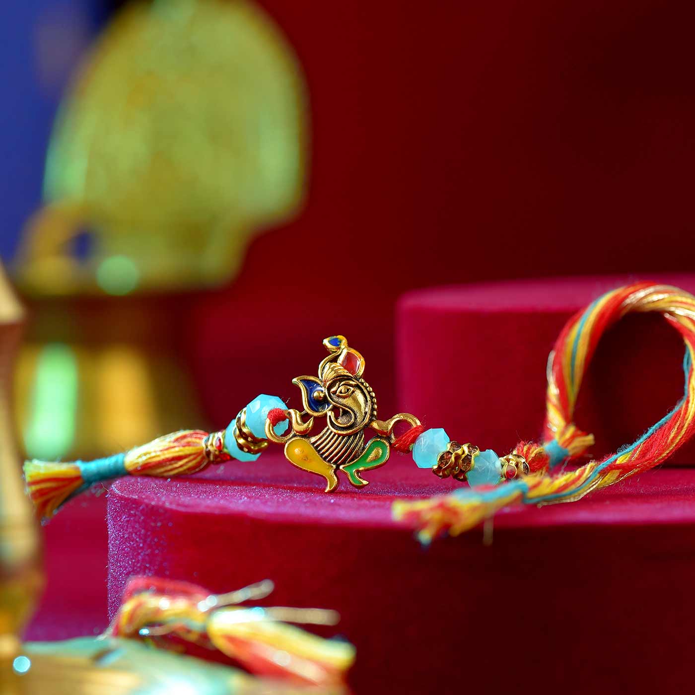 Blessed Ganesha Colorful Pearls & Mauli Dori Rakhi - 12 Pcs Pack