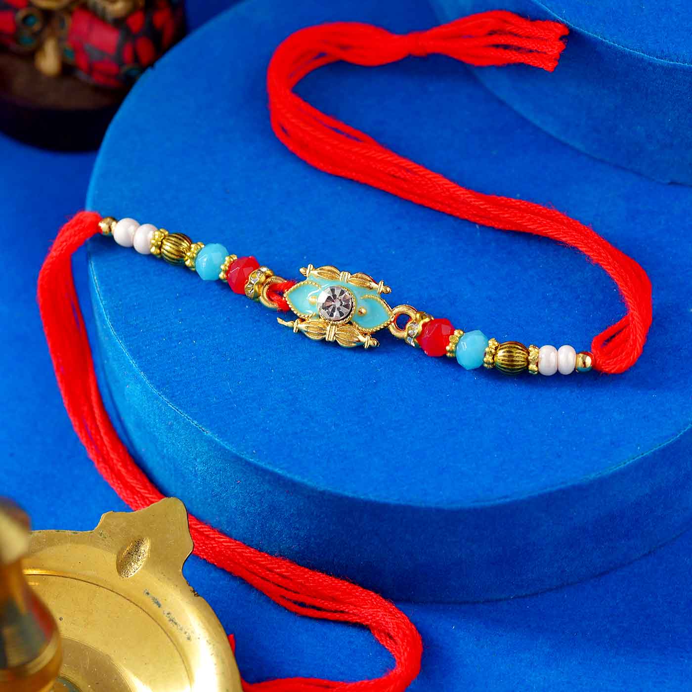 Antique Finish Coloful Rakhi With Blue Pearls & Beads - 12 Pcs Pack