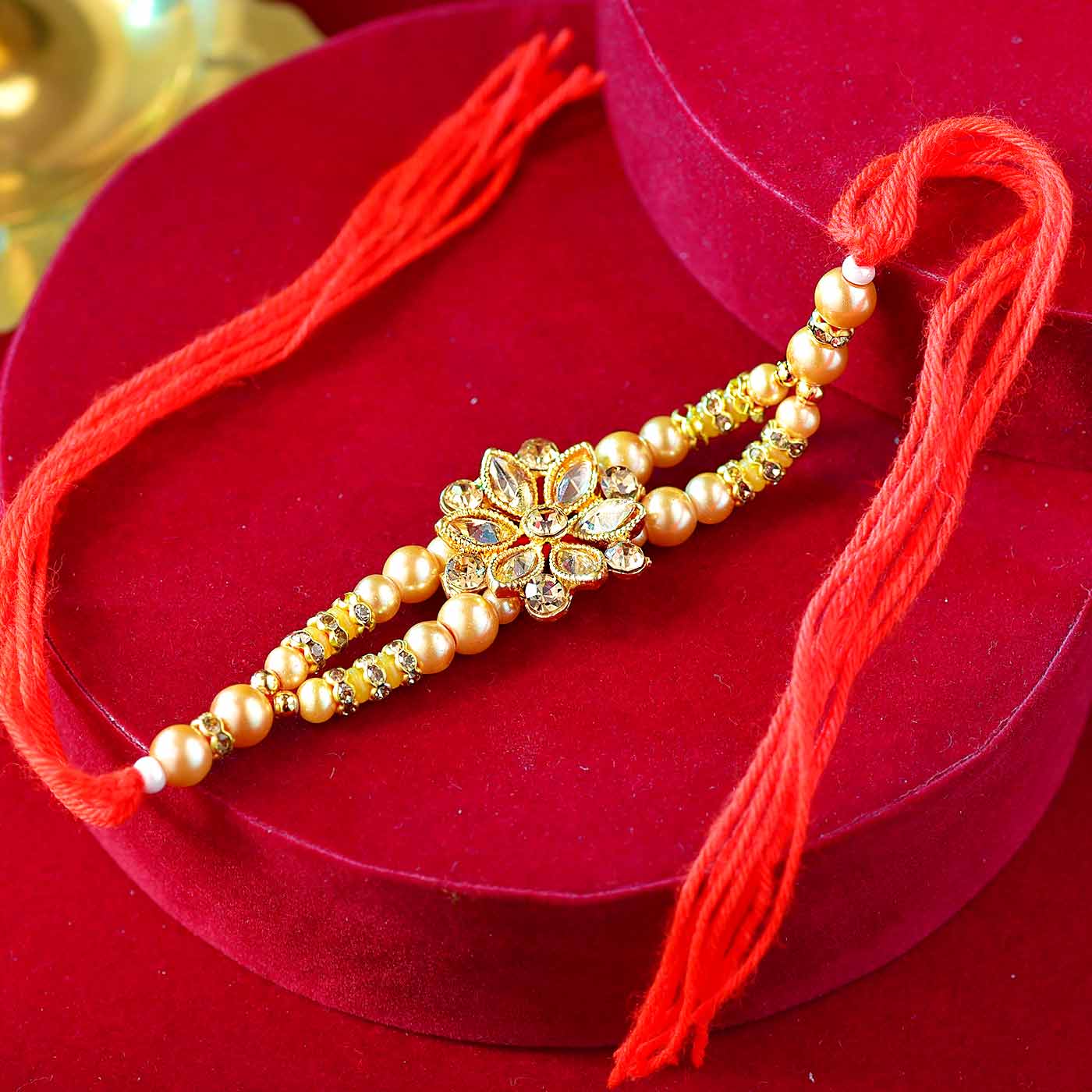 Floral Stone, Kundan & Pearls Rakhi – 12 Pcs Pack
