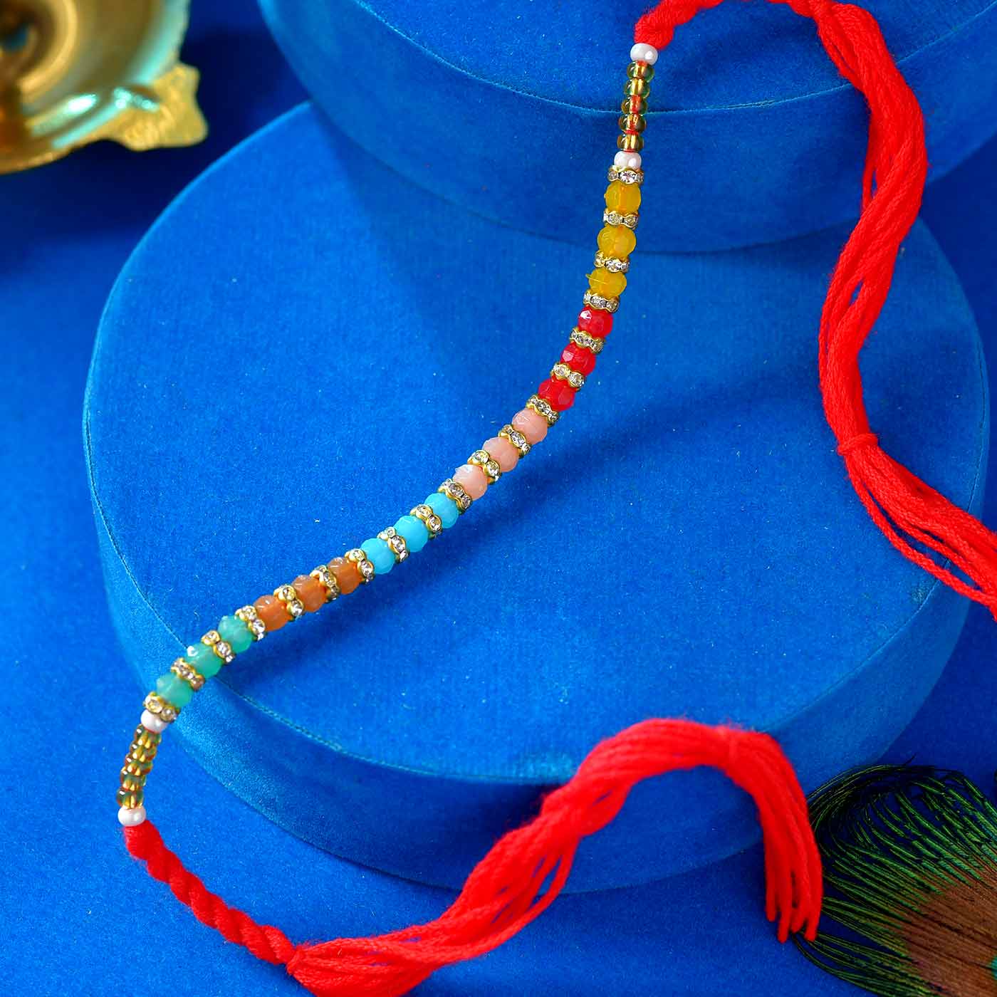 Multi Color Pearls & Stone Rakhi - 12 Pcs Pack