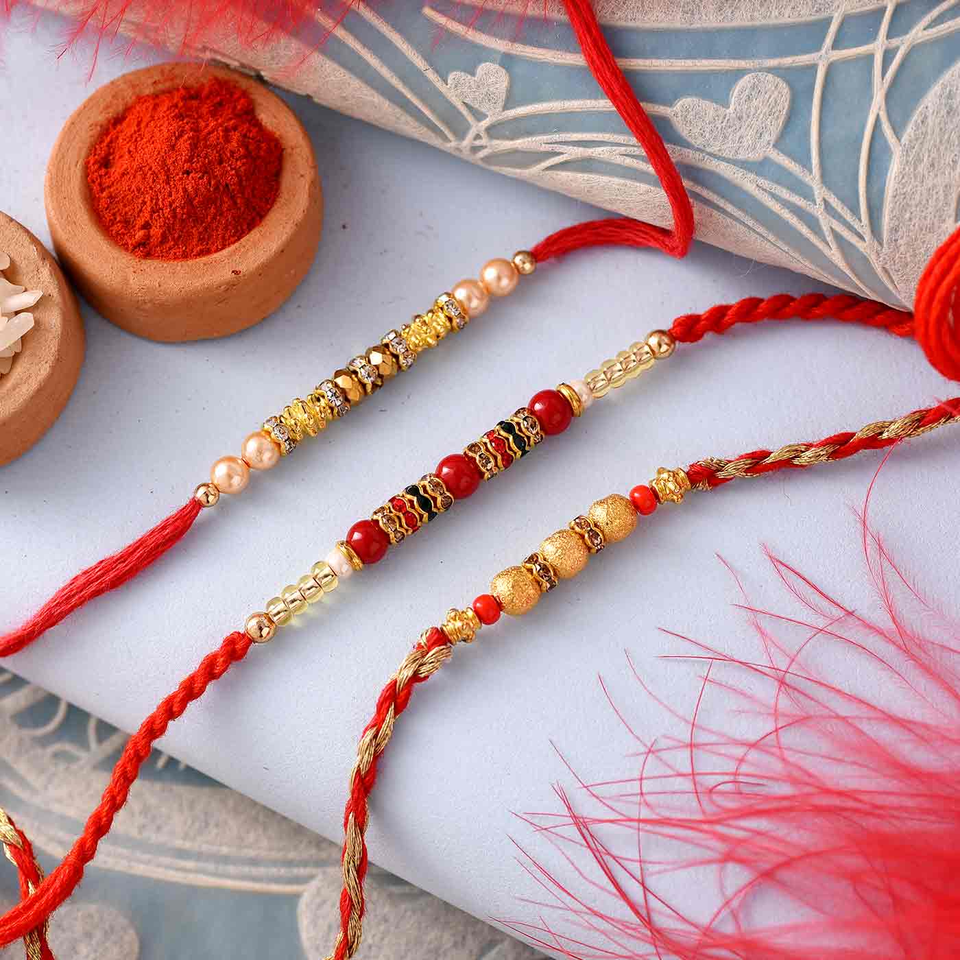 Beautiful Beads, Stones & Pearl Work Set Of 3 Rakhis - 12 Pcs Pack