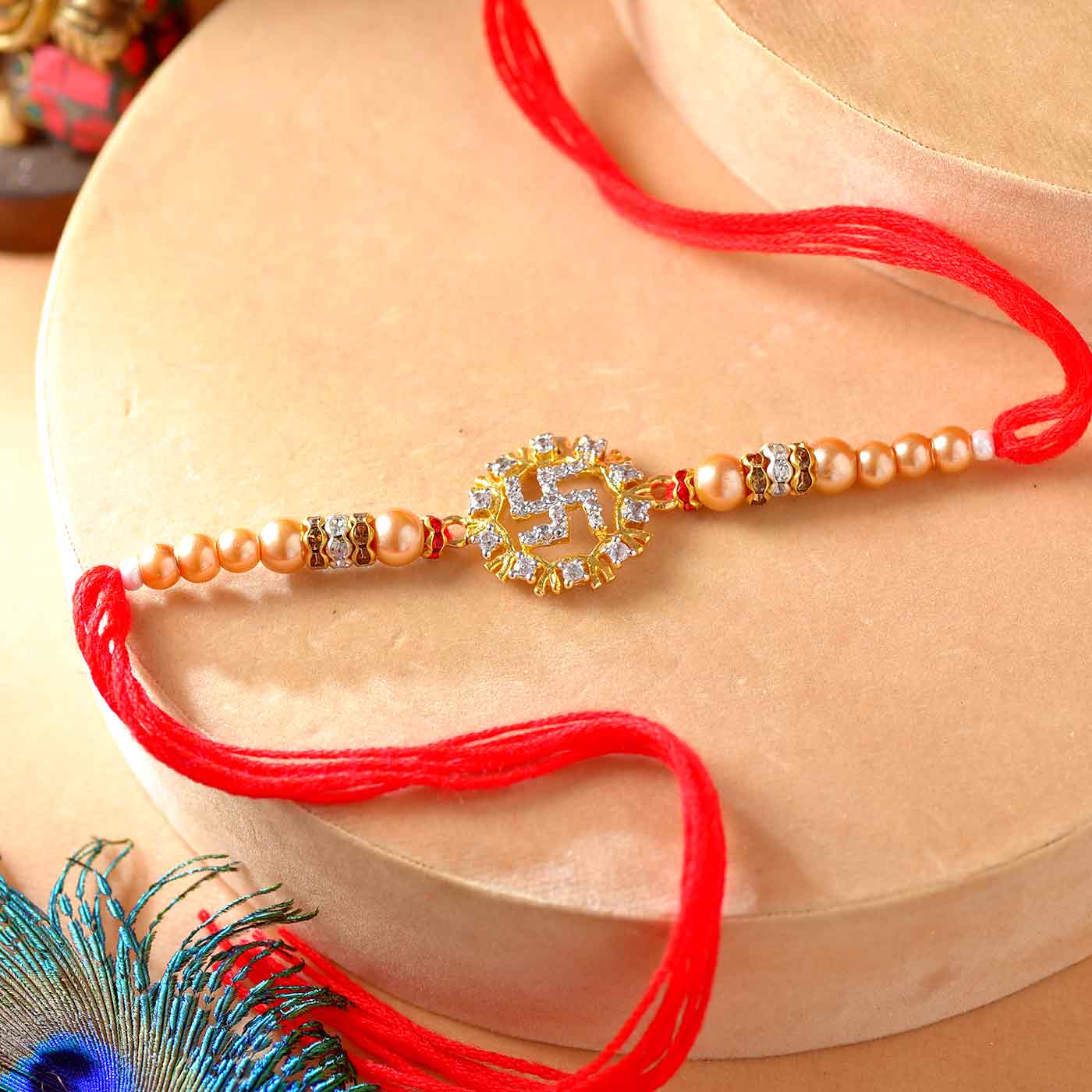 American Diamond Swastik Rakhi With Pearls - 12 Pcs Pack