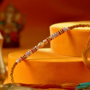 Dazzling Golden Pearl & Stone Rakhi - 12 Pcs Pack