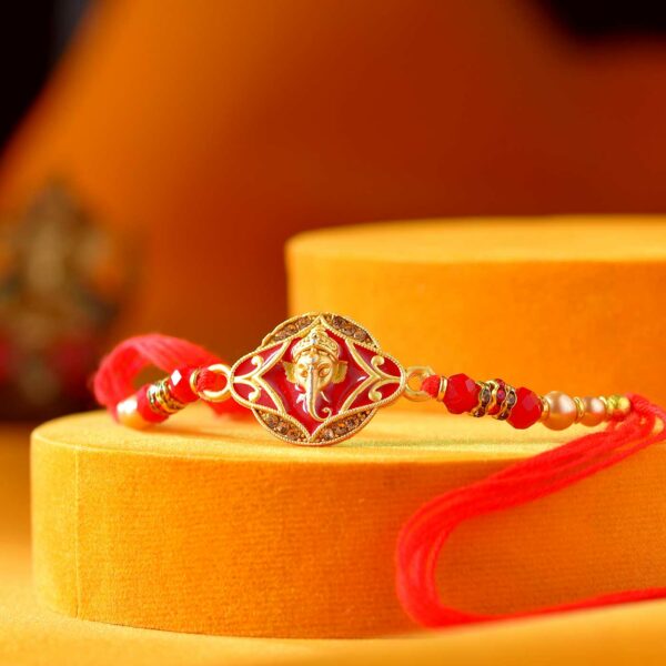 Divine Ganesha Red & Golden Pearl Rakhi - 12 Pcs Pack