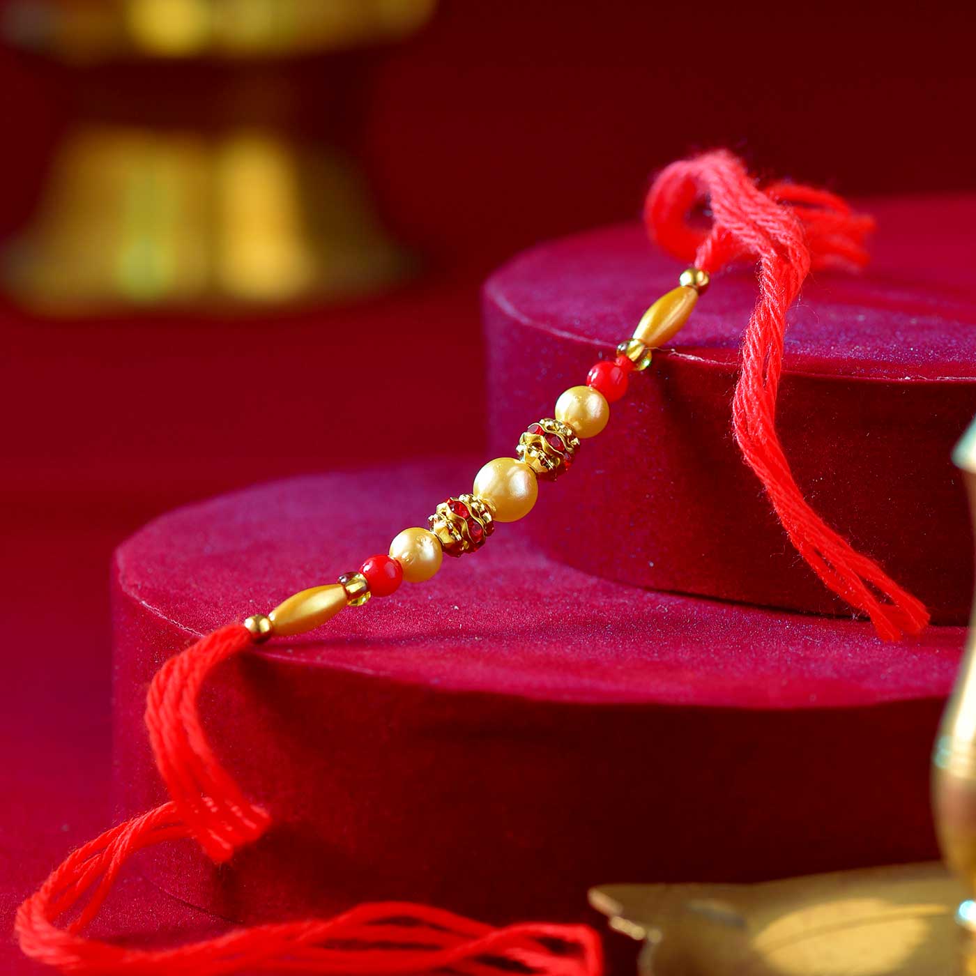 Beautiful Golden & Red Beads Rakhi – 12 Pcs Pack