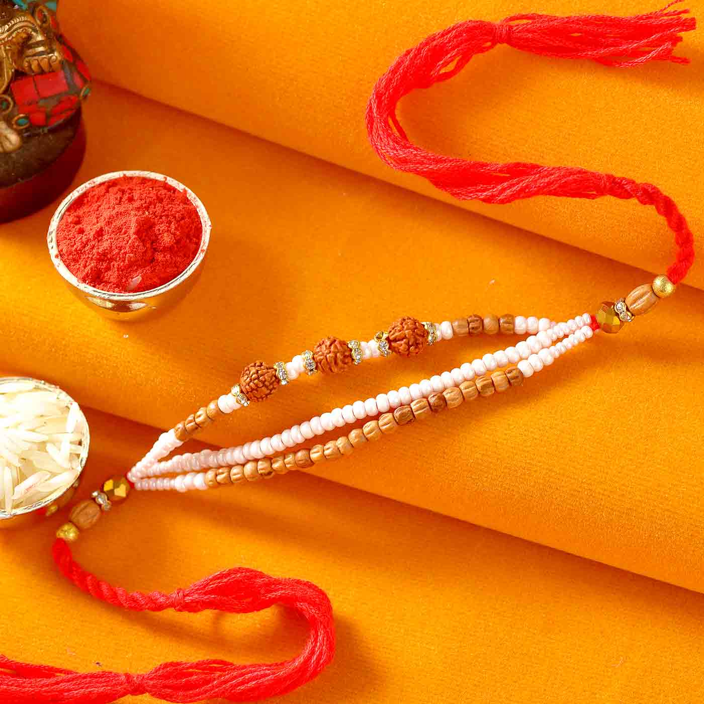 Rudraksh Rakhi With Tiny Pearls & Tulsi Beads - 12 Pcs Pack