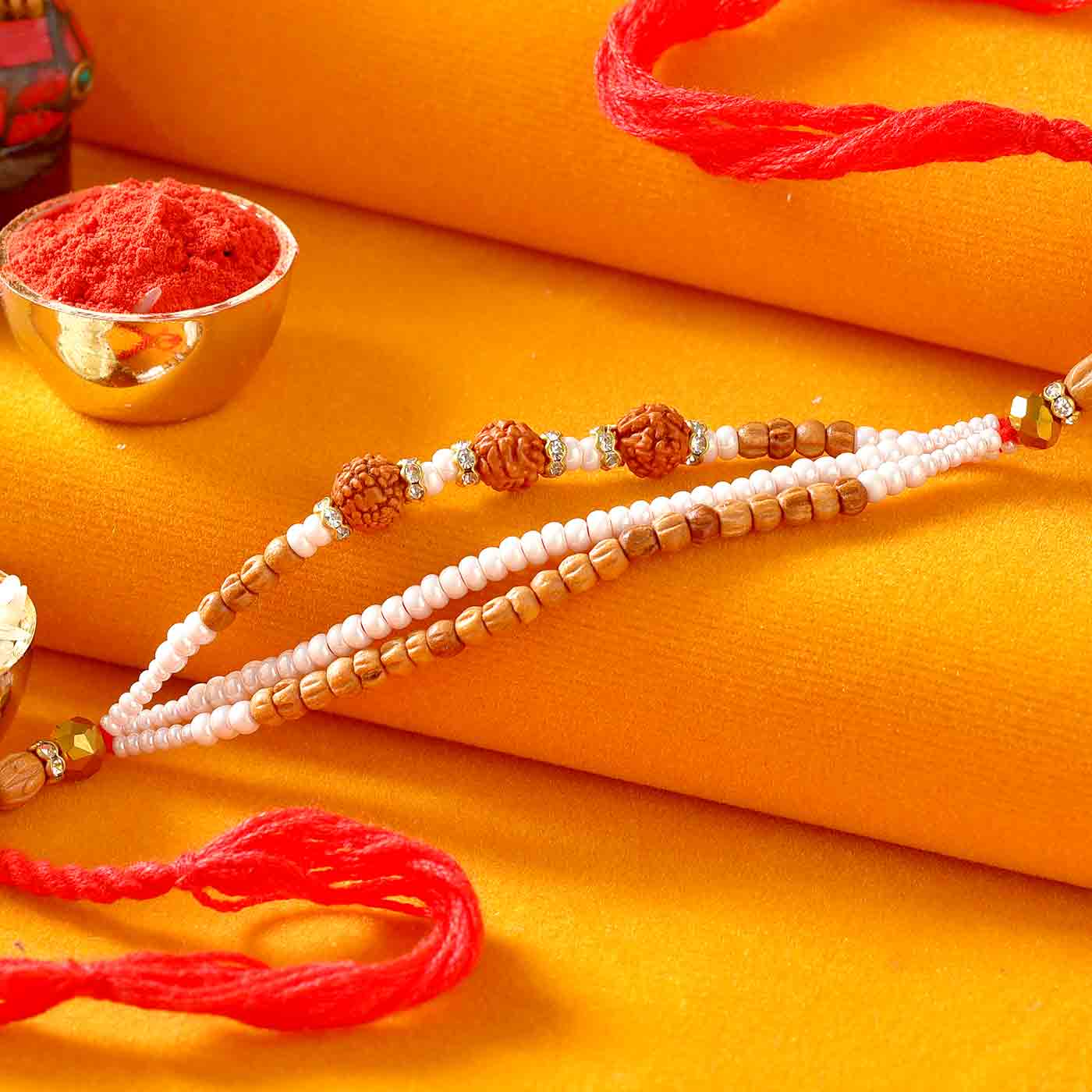 Rudraksh Rakhi With Tiny Pearls & Tulsi Beads – 12 Pcs Pack