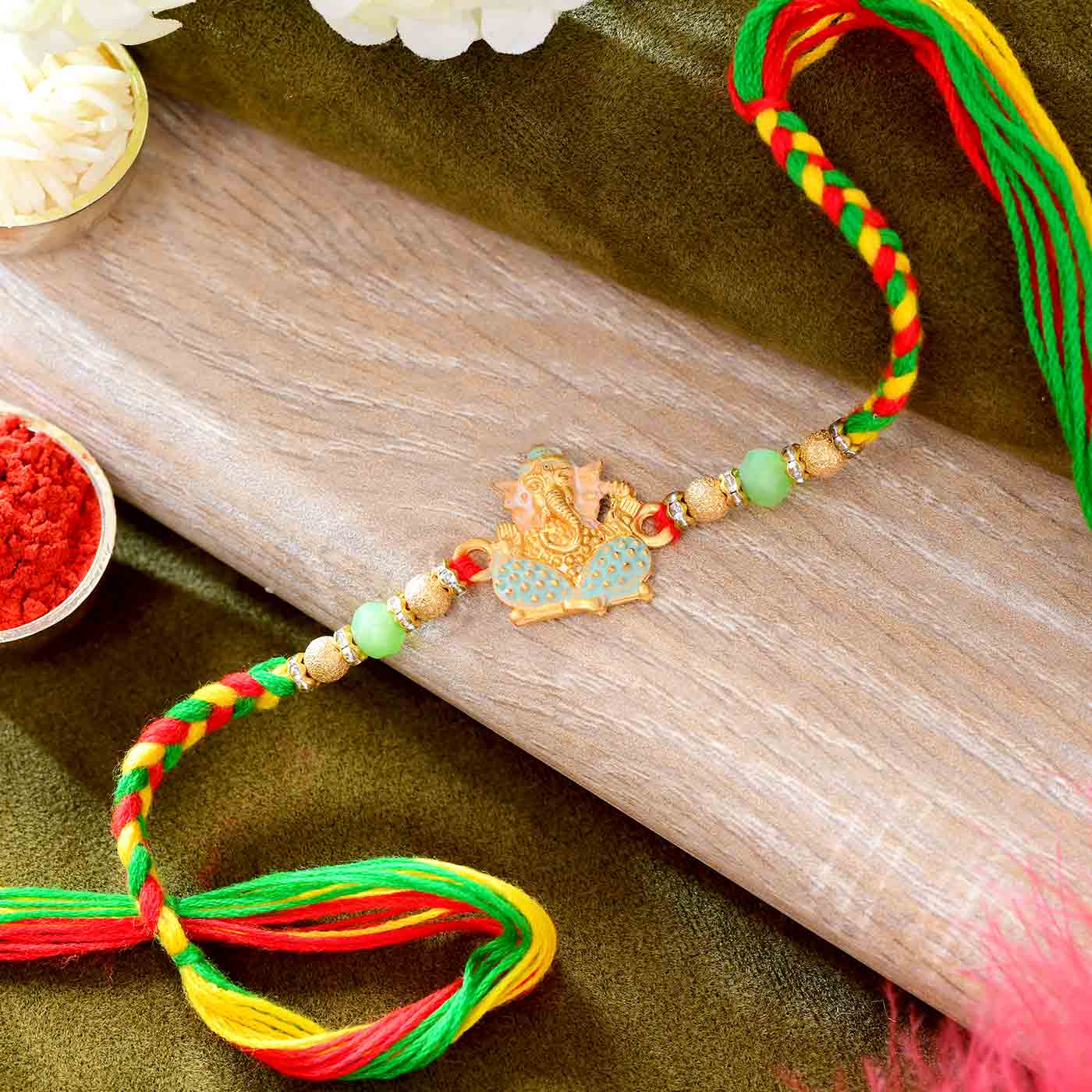 Traditional  Ganesha Rakhi With Colorful Beads &Pearls - 12 Pcs Pack
