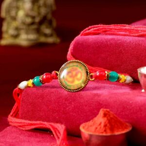 Auspicious Om Rakhi With Colorful Beads & Pearls - 12 Pcs Pack