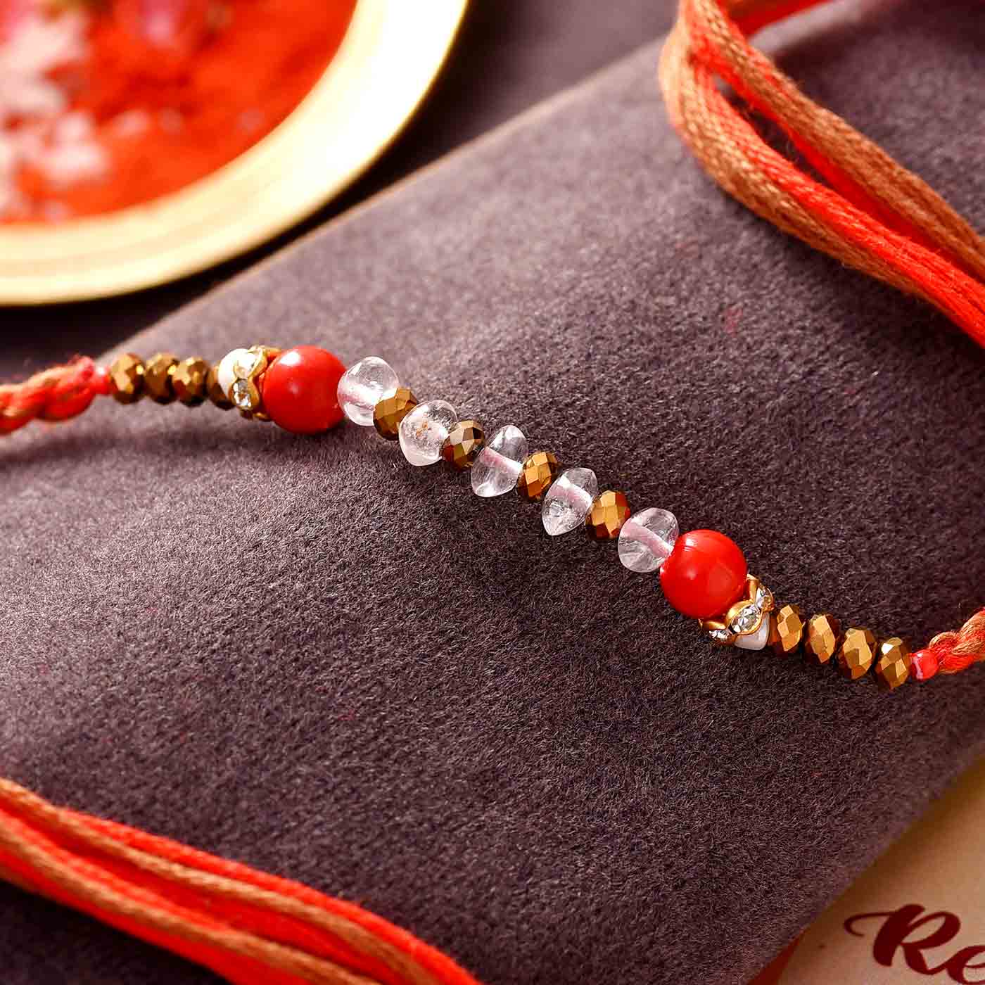 Vitality Stone Red Jade Rakhi – 12 Pcs Pack