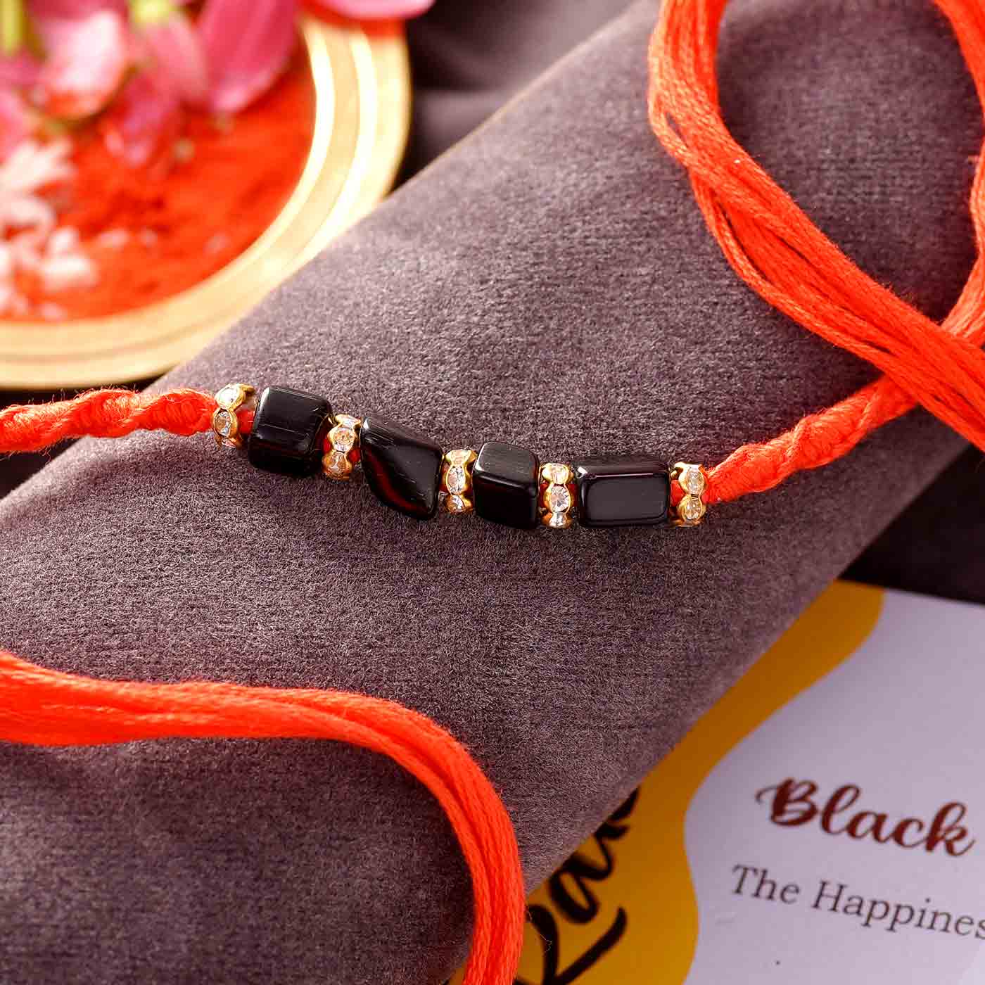 Happiness Stone Black Onyx Rakhi – 12 Pcs Pack